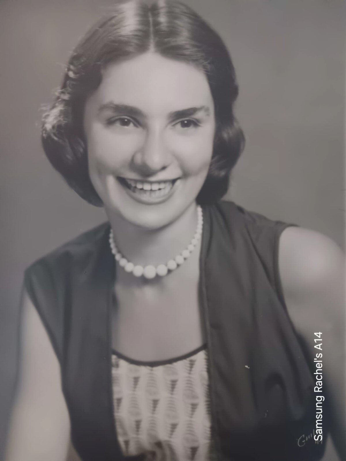 A black-and-white studio portrait of Toby at twenty.